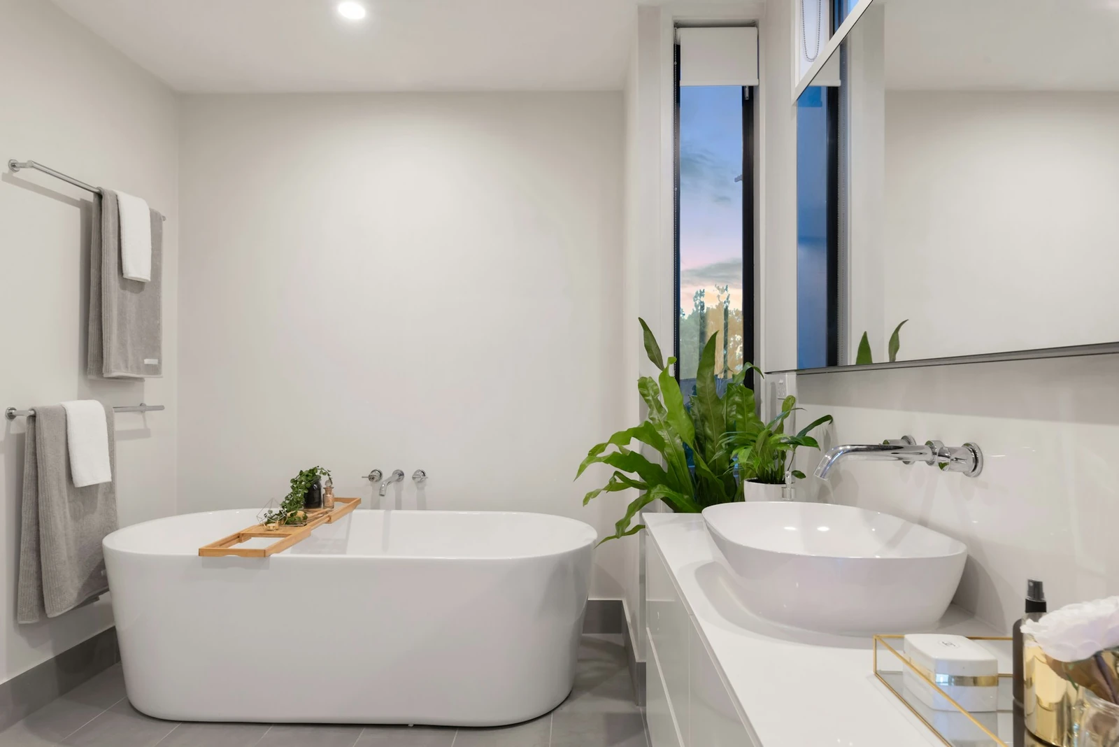 Stock photograph of a contemporary bathroom with a bath and basin